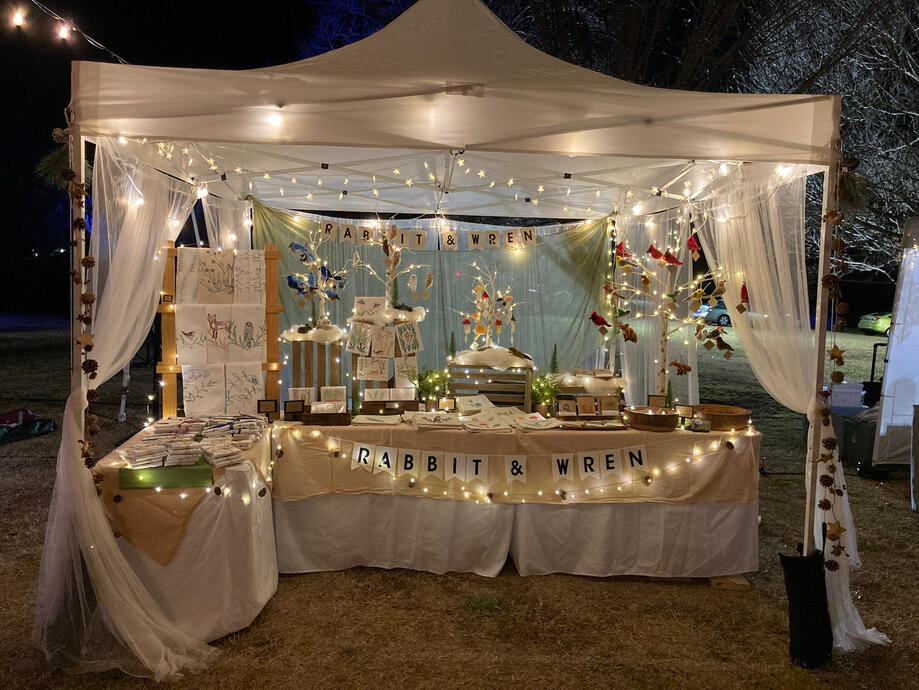 image of a craft fair booth at night