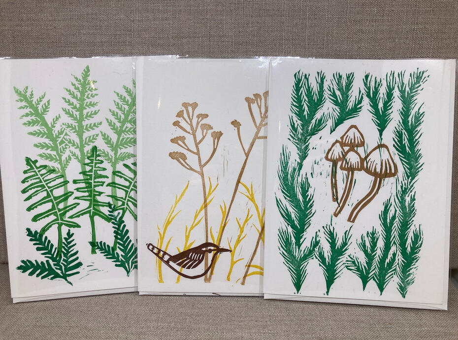 image of three hand-printed cards featuring vegetation